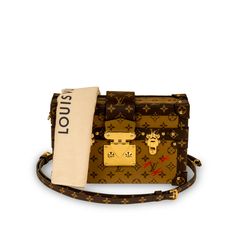 A truly unique piece from Louis Vuitton, the Petite Malle was inspired by trunks originally created in the early 20th century for elite banker Albert Kahn. Carefully crafted from the reverse LV monogram canvas with the classic monogram trimming, romantic gold tone hardware, and three red cross detailing - the Petite Malle is a must-have for any luxury lover. The perfect option to accessorize any outfit from day to night, this piece will compliment pretty much anything you have in your wardrobe. Designed for any modern woman with a fashion forward sense of style and a love for timeless pieces with a contemporary edge. A well-worthy addition to any luxury handbag collection, the Petite Malle is an absolute must-have. SPL Exterior Louis Vuitton Reverse Monogram canvas Classic Monogram trimmin Louis Vuitton Petite Malle, Classic Monogram, Handbag Collection, Lv Monogram, Dior Shoes, Red Cross, Exclusive Bag, Casual Backpack, Embossed Logo