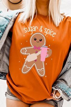 Get ready for the festive season with this cozy gingerbread short-sleeved tee. This adorable holiday top features a charming gingerbread graphic with the sweet phrase 'sugar & spice' adding a dash of festive cheer. Made with soft, durable fabric, it's perfect for casual outings or lounging at home. The vibrant red color is sure to make you stand out at any Christmas gathering. Its relaxed fit ensures maximum comfort, making it an ideal gift for yourself or a loved one. Pair it with jeans or paja Snap Jewelry Charms, Concealed Carry Handbags, Holiday Tops, Plus Swimwear, Romper And Jacket, Knitted Coat, Cardigan Tops, Unisex Shorts, Sugar And Spice