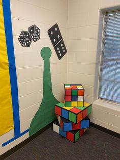 the room is decorated with colorful blocks and dices for children to play in it