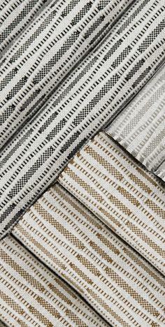 several different types of woven fabrics are stacked on top of each other in this close up photo