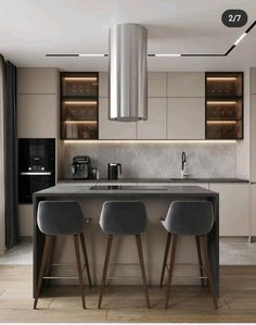 a kitchen with two stools next to a counter top and an island in the middle