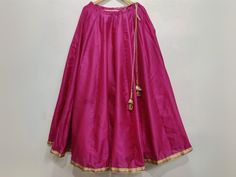 Magenta lehenga skirt for women. Plus size available. Size: This is custom made outfit as per your size. Post your order we will send you a measurements reference sheet using which you can provide details required to make your outfit with best fit. Fabric and work: Lehenga - Made with taffeta silk. Delivery time: This piece will take 2-3 weeks to produce after we have received your sizing details. Don't worry it can be made sooner too, just keep us informed, we will process it accordingly and deliver on or before a delivery date we discuss. Note: Color may slightly vary due to digital photography and display screen settings. Laces and trims may change based on availability. Festive Lehenga With Tilla, Festive Lehenga With Tilla Detailing, Navratri Sharara With Tilla Details, Navratri Tilla Sharara, Elegant Designer Skirt With Traditional Drape, Designer Wear Traditional Drape Skirt For Navratri, Long Skirt Sharara With Dupatta, Festive Tilla Anarkali Set, Pink Long Skirt Sharara For Navratri