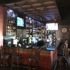 a bar with lots of liquor bottles on the shelves