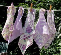 four towels hanging on a clothes line outside