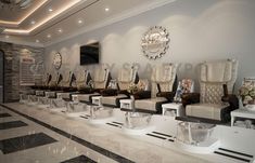 a row of white chairs sitting next to each other on top of a tiled floor