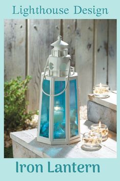 an iron lantern sitting on top of a wooden table