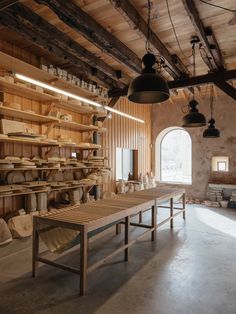 a room filled with lots of wooden shelves