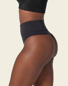 This shaper thong panty is the perfect combo between compression and coverage. Moderate compression in the mid-to-lower tummy shapes your silhouette comfortably. Made of our super soft seamless SkinFuse® fabric for a second skin feel. Its double-layered waistband and flexible boning keep it in place and accentuate your curves. Seamless High Stretch Shapewear For Workout, Supportive Seamless Shapewear For Workout, Seamless High-stretch Shapewear For Workout, Supportive High Stretch Seamless Shapewear, Supportive Seamless Workout Shapewear, Seamless Compression Shapewear, High Waist Seamless Shapewear For Yoga, High Stretch Smoothing Shapewear For Workout, Compressive High-cut Leg Shapewear With Seamless Construction