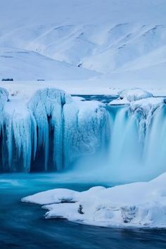 a frozen waterfall in the middle of winter