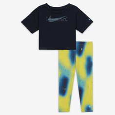 This 2-piece set is an easy way to dress little ones in coordinated Swoosh style. The tee is made of jersey knit fabric in a boxy cut that creates a cropped look while providing full coverage. The leggings are made of soft and stretchy jersey knit fabric enhanced with quick-drying, moisture-wicking Dri-FIT technology to keep kiddos comfy at play. Nike Cotton Athleisure Sets, Sporty Graphic Print Sets For Playwear, Sporty Playwear Set With Graphic Print, Sporty Graphic Print Playwear Set, Playful Blue Sets With Graphic Print, Nike Cotton Playtime Sets, Playful Nike Playwear Sets, Boxy Tee, Leggings Set