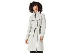 Calvin Klein Faux Leather Trim Belted Wrap Coat - Women's Clothing : Light Grey : Embrace the cooler weather in chic style with the Calvin Klein Faux Leather Trim Belted Wrap Coat. Fold over collar with asymmetric front zipper closure. Inner bib offers a stand collar, front zip closure. Long sleeve design. Removable self fabric tie belt. PU-trim details throughout. Side zip-closure pockets, back vent. 53% wool, 41% polyester, 2% nylon, 1% acrylic. Professional dry clean. Imported. Measurements: Calvin Klein Wrap Coat, Classic Double-breasted Wool Coat With Belted Cuffs, Calvin Klein Coat, Long-sleeve Wool Coat With Self Belt, Fitted Calvin Klein Single-breasted Outerwear, Calvin Klein Single-breasted Winter Outerwear, Belted Wrap Coat, Wrap Coat, Collared Coat