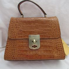 Description: Brand: Patricia Nash Chauny Condition: New With Tags Color: Cognac/Brown Material: Leather Style: Crossbody Hardware: Polish Dust Cover: Yes Closure: Zipper Bag Height: 8.0" Inches Bag Width: 10" Inches Bag Depth: 4.0" Inches Exterior Details: 1 Pocket Interior Details: Zipper Pockets And 2 Elastic Pockets, 1 Side Pockets Inside The Purse Saddle Bag Purse, Crossbody Saddle Bag, Boho Handbags, Tooled Leather Purse, Italian Bags, Exterior Details, Brown Leather Shoulder Bag, Leather Floral, Black Leather Crossbody Bag