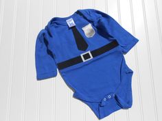 "Great Costume / Present or Costume for Cosplay Long Sleeve This adorable police officer inspired bodysuit is made of a soft, royal blue, 100% cotton in your choice of size. The appliques are cut of cotton fabric, ironed on, and then zig zag sewn around the edges for durability. The bodysuit has a cute red satin heart on the rear end. Bottoms up! These are Rabbit Skin brand bodysuits. Newborn 5 - 10 lbs 6 Months 11-14 lbs 12 Months 15-20 lbs 18 Months 21-24 lbs  baby shower gift or to take along Old Halloween Costumes, Quick Halloween Costumes, Great Halloween Costumes, Police Gifts, Take Home Outfit, Baby Costumes, Home Outfit, Red Satin, Halloween Cosplay