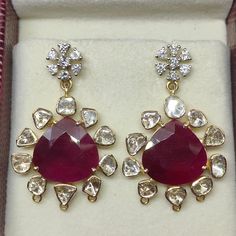 Product code: 280000 weight: 12.300 grams gemstone name: ruby gemstone weight: 18 cts (heart) diamond weight: 2.00 cts (uncut rosecut) + 1.01 ct (excellent deluxe rbc) closure: screwback dimensions: 38 mm x 25 mm ps: 3 small links at bottom of each earring is optional for hanging beads or any additional customisation. if not needed, please add in personalisation message and we will remove them. Fine Jewelry Ruby Diamond Earrings, Ruby Gemstone Diamond Earrings In Fine Jewelry Style, Ruby Diamond Earrings Fine Jewelry, Ruby Diamond Earrings In Fine Jewelry Style, Ruby Gemstone Diamond Earrings For Formal Occasions, Formal Ruby Gemstone Diamond Earrings, Red Diamond Hallmarked Earrings, Ruby Diamond Earrings For Anniversary, Rose Cut Diamond Earrings For Party