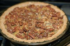 a pecan pie sitting on top of an oven