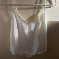 Color: Ivory Original Price: $29 Never Worn Flaw Has A Tiny Spot Inside The Top Near The Tag (May Be Washable) This Top Is Super Classy And Easy To Pair With But Is Too Small For Me White V-neck Camisole For Vacation, White V-neck Tank Top For Brunch, Chic Linen Camisole For Day Out, Linen Camisole For Day Out, White Linen Tank Top For Day Out, White Linen Cami Tank Top, White Cotton Chic Camisole, White V-neck Crop Top For Summer, Chic White Cotton Camisole