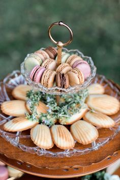 an assortment of macaroons on a glass platter