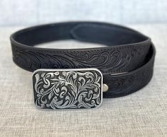 ABOUT:  ➤Stainless steel buckle with floral pattern ➤ 1-1/2" wide ➤100% handmade from one-piece full grain cowhide leather ➤Custom engraving option on the inside of belt ➤Belt thickness 3.2 mm - 1/8" thickness ➤ Easy snap system for interchanging buckles Personalized Belt that serves as a great gift for your loved one. You can choose to personalize this belt, making it an Engraved Belt. This is a handmade western leather belt with a stainless-steel cowboy buckle.  Tooled Western Floral Engraved Handmade Adjustable Western Belt Buckles, Adjustable Western Belt Buckles For Everyday Use, Classic Adjustable Hand-tooled Belt, Classic Adjustable Hand Tooled Belt, Formal Adjustable Engraved Belt, Engraved Leather Belt Buckles, Adjustable, Engraved Leather Adjustable Belt Buckles, Adjustable Engraved Leather Belt Buckles, Handmade Adjustable Leather Belt Buckles