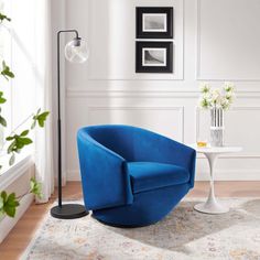 a blue chair sitting on top of a white rug