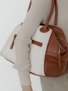 Editor's NotesCHRISTINE PROJECT's signature designed canvas bag can be matched with any casual outfits.- Sophisticated and casual mood- Mix-match of canvas and leather- Waterproof canvas fabric- Enough storage space- Daily point itemMeasurements(in.)One size (Unisex)- Body : 15.35 in. (W) * 9.84 in. (H) * 7.48 in. (D)- Handle : 7.48 in.- Weight : 1.54 lbComposition & Care- Vegan leather, Canvas- Natural leather may have fine scratches and wrinkles- Bright-toned leather can get colored by den Leather Canvas Bag With Large Capacity For On-the-go, White Shoulder Bag With Leather Trim For On-the-go, Luxury Canvas Weekender Bag With Large Capacity, Luxury Large Capacity Canvas Weekender Bag, Versatile Canvas Bag With Zipper Pocket, Modern Leather Canvas Bag For On-the-go, Chic Coated Canvas Bag For On-the-go, Leather Canvas Bag With Canvas Lining For On-the-go, Versatile Canvas Satchel For Errands