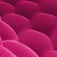 an up close view of a pink couch cushion