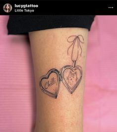 two heart shaped tattoos on the leg