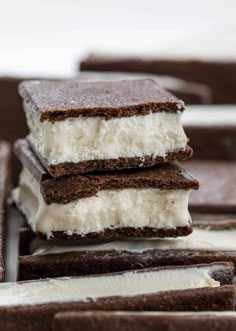 three ice cream sandwiches stacked on top of each other with chocolate and white frosting