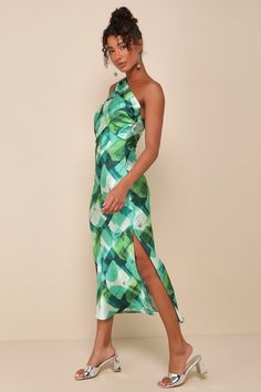 Catch everyone's attention with a memorable look like the Lulus Iconic Presence Green Abstract Satin One-Shoulder Midi Dress! Sleek woven satin, with a green abstract print throughout, shapes a single, sash strap that crosses the one-shoulder neckline and secures atop the open-back design with a knotted detail at the side. Fitted bodice features an asymmetrical, overlay with gathering at the sides. The figure-skimming silhouette continues into a slip-style skirt that finishes at a midi hem with Green Abstract Print Midi Dress, Green Midi Length Dress With Abstract Print, Green Midi Dress With Abstract Print, Green Abstract Print Party Dress, Silk Abstract Print Party Dress, Silk Party Dress With Abstract Print, Silk Dress With Abstract Print For Party, Green Silk Sleeveless Midi Dress, Green Sleeveless Silk Midi Dress