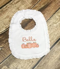 This beautiful personalized bib is perfect for your new baby or to give as a baby gift. This white bib is a beautiful, soft boutique qualtiy 100% cotton bib with ruffles that closes with velcro for easy on/off. The name will be as shown. Please include in the comment section when ordering the name you would like for the personalization. Please make certain that the name is spelled correctly; we cannot offer refunds due to personalization. Customizable White Bib For Babies, Personalized Cotton Bib As Gift, Cute White Bib Front Bib, Customizable White Cotton Bib, Cute Machine Washable Bib As Gift, White Machine Washable Bib For Gift, White Machine Washable Bib As A Gift, White Machine Washable Bib As Gift, Personalized White Bib For Birthday