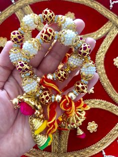 * Buyers outside UK please carefully read Dispatch and Shipping timelines 🙏 These Gana / Gaana / Gaaney comes adorned with pearl balls/trinkets/Thread balls. Ends are finished with tassels, pom poms and conical shells in Gold. Dosti Gana / Kangan symbolises deep love and solidarity between Bride/Groom and their friends. Sisters brothers and friends of Bride and Groom also tie these sacred threads around their wrists to show their active participation in the wedding functions and for showering t Traditional Navratri Festival Bracelets, Bohemian Bracelets For Diwali Festival, Pink Cutdana Bracelets For Festivals, Bohemian Bangle For Puja Festivals, Bohemian Bracelets For Puja During Diwali, Bohemian Bracelets For Diwali Puja, Traditional Bracelets For Diwali Festival, Bohemian Bracelets For Puja And Diwali, Bohemian Multicolor Bracelets For Navratri