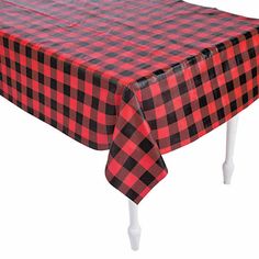 a red and black checkered tablecloth with white legs