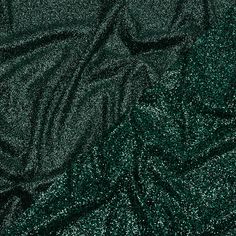 The Emerald City outdid itself on this beautiful Gala Dark Emerald and Black Double Faced Glitter Tulle. A black tulle base is adorned with black and dark green glitter on both sides, with one side showing a finer glitter than the other. The crisp hand and weighted drape make it an excellent choice for evening gowns, skirts, ball gowns, and bold capes, or use it for special occasion dresses, such as for weddings or quinceañeras. Opaque, a lining can be used for comfort if desired. Dark Green Glitter Dress, Emerald Green Aesthetic Tumblr, Midnight Green, Emerald Green Aesthetic, Emerald Green Wedding Dress, Emerald Green Outfit, Sequence Fabric, Green Aesthetic Tumblr, Dark Green Wallpaper