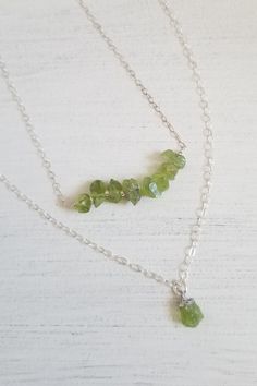 Peridot: The birthstone for August. A crystal rich in culture, mysticism and healing power. A stone that helps to boost the confidence of those wearing it, as well as attracting luck, love & wealth. Brings peace & harmony to one's life. TWO Piece Necklace Layering Set! Gorgeous raw green Peridot is elegant yet rustic. This is a two piece layering necklace set. Your choice of Sterling Silver or Gold Filled. Solid lobster claw clasp. Details: * Natural raw Perdiot nugget chips Size: Betwee Peridot Gemstone Beads Necklace As Gift, Peridot Gemstone Bead Necklace For Gift, Peridot Gemstone Beads Necklace For Gift, Peridot Jewelry With Natural Stones For Healing, Spiritual Peridot Jewelry With Gemstone Accents, Spiritual Peridot Jewelry With Gemstone, Spiritual Peridot Gemstone Jewelry, Necklaces For Her, Raw Peridot