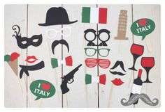 the photo booth is decorated with different types of masks and mustaches, such as wine glasses