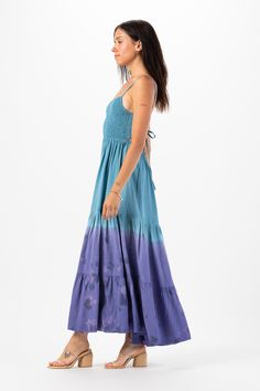 With its floor-grazing length, the Avisa Maxi Dress exudes bohemian elegance, making it perfect for everything from beach weddings to summer soirées. Whether you're dancing under the stars or strolling along the shore, this dress is sure to make you feel like a goddess. Details: 100% Rayon Hand Wash in Cold Water and Lay Flat to Dry Features: Unlined, Smocked Bodice, Self-tie spaghetti strap closure, Tassel tie detail on straps, Open back detail for an adjustable fit, Tiered Maxi Skirt. Measurem Floor-length Smocked Back Dress For Vacation, Floor-length Smocked Back Vacation Dress, Floor-length Vacation Dress With Smocked Back, Blue Bohemian Maxi Dress With Smocked Back, Blue Floor-length Maxi Dress For Festival, Bohemian Smocked Back Maxi Dress For Vacation, Breezy Maxi Dress With Smocked Back For Beach Season, Floor-length Maxi Dress With Smocked Back For Vacation, Beach Smocked Bodice Maxi Sundress