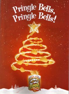 a can of pringle bells in the snow with a christmas tree on top