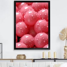 a living room filled with lots of white furniture and pink balls covered in water droplets