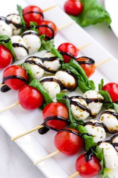 an avocado with mozzarella and cherry tomatoes