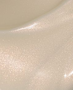 a close up view of the top of a white sink with glittery paint on it