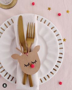 a white plate topped with a paper reindeer face