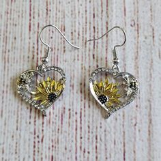 New With Tags. Heart Sunflower Bee Dangle Earrings. These Are So Pretty With Lots Of Detail! Colors Of Silver, Yellow, And Brown. Heart Shapes Earrings With Sunflowers And Bumble Bees. There Are Also Tiny Rhinestones Along The Heart. Lightweight. Please See Photos For Approximate Measurements. Smoke Free And Pet Friendly Home. Bundle Your Likes To Save On Shipping! Please Note That Colors May Differ Slightly Due To Camera, Lighting, Background, Or Your Viewing Device. #032 Yellow Heart-shaped Jewelry, Yellow Heart-shaped Jewelry For Mother's Day, Yellow Heart Earrings For Gift, Yellow Heart-shaped Earrings For Gift, Yellow Sunflower Dangle Jewelry, Yellow Sunflower Design Dangle Jewelry, Heart Sunflower, Lighting Background, Brown Heart