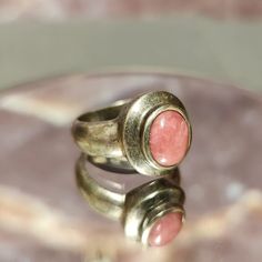 Immerse yourself in the allure of vintage charm with this unique Vintage Tarnished Pink Agate on Sterling Silver Ring. Crafted with a sterling silver setting and adorned with a beautifully weathered pink agate, this ring tells a story of timeless elegance and character. Sized at 8, this vintage piece is ready to add a touch of rustic beauty to your collection. Details: Material: Genuine Sterling Silver Stone: Tarnished Pink Agate Size: Ladies Size 8 Design: Vintage, Tarnished, Rustic Elegance Wh Pink Agate, Rustic Elegance, Vintage Beauty, Design Vintage, Rings Statement, Vintage Charms, Sterling Silver Ring, Unique Vintage, Beautiful Rings