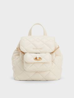 With its versatility and timeless style, the Aubrielle is the perfect grown-up backpack. The cream quilted finish will add a subtle textural detail to your outfits - the complementary gold-toned hardware gives the carry-all an elegant and polished appearance. Designed with functionality in mind, this bag comes with a detachable pouch that will keep your small items organised, while the adjustable strap lets you customise the fit. Chic Everyday Backpack With Gold-tone Hardware, Elegant Beige Backpack, Elegant Beige Backpack With Zipper Closure, Chic White Backpack, Charles And Keith, Quilted Backpack, Brand Collaboration, Size Chart For Kids, How To Finish A Quilt