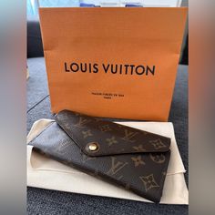 Just Replaced The Button Closure At The Louis Vuitton Store On Rodeo Drive, So Now It’s Brand New. There Is Some Wear On The Ends Of The Wallet, Refer To The Pics. Comes With The Bag & Pouch. Smoke Free Home! Designer Travel Wallet In Envelope Shape, Designer Envelope Wallet For Travel, Designer Travel Envelope Wallet, Luxury Brown Wallets For Office, Luxury Brown Wallets, Elegant Monogram Canvas Wallet Gift, Louis Vuitton Sarah Wallet, Louis Vuitton Store, Bags Louis Vuitton