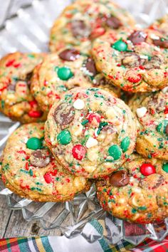 chocolate chip cookies with candy and sprinkles on a glass platter, ready to be eaten