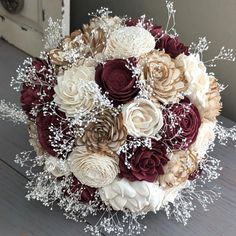 a bridal bouquet with red and white flowers