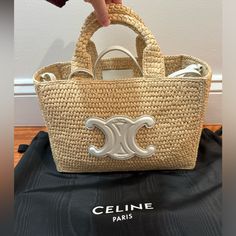 11 X 7 X 5 In (27 X 19 X 13 Cm) Raffia, Unlined Gold Finishing Shoulder Carry One Inner Removable Zipped Pocket In Leather Handles With 5 In (12 Cm) Drop Removable And Adjustable Strap With A Minimum Drop 17 In (44cm) And Maximum Drop 18 In (46 Cm) Hand-Braided Baskets, Making Each Piece Unique. Sizes And Shapes May Slightly Differ. Celine Raffia Bag Outfit, Celine Raffia Bag, Designer Beige Straw Bag With Top Handle, Luxury Rectangular Straw Bag For Shopping, Luxury Rectangular Straw Shopping Bag, Designer Straw Bag With Handles, Designer Rectangular Straw Bag In Natural Color, Designer Beige Rectangular Straw Bag, Designer Rectangular Natural Straw Bag