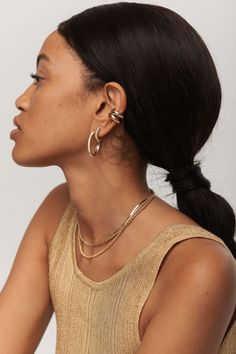 This Hoops redefine the art of understated luxury. Each hoop is meticulously crafted from 14K gold, showcasing a ribbed texture that catches the light and adds a touch of sophistication to any outfit. Whether you’re dressing up for a formal event or adding a subtle hint of glamour to your everyday style, these hoop earrings elevate your look with their timeless appeal and impeccable craftsmanship. Designed for those who appreciate elegance and versatility, the Lulu Textured Hoops offer more than Minimalist Yellow Gold Hoop Earrings For Evening, 14k Gold Hoop Earrings For Evening, Timeless Luxury, Understated Luxury, Ribbed Texture, Everyday Style, Formal Event, Everyday Fashion, Hoop Earrings