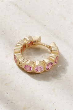 "Colored gemstones are having a big moment," says Maxim De Turckheim, MR PORTER's Senior Buyer for jewelry. "42 SUNS has gone all out on this trend. It's definitely one to watch." This small single hoop earring is crafted from 14-karat gold and pavé set with laboratory-grown pink sapphires. Stack yours with other colorful designs. 14k Gold Huggie Jewelry With Bezel Setting, Fine Jewelry Gemstone Hoop Earrings, Luxury Round Hoop Earrings With Gemstones, Gemstone Hoop Earrings Fine Jewelry, Yellow Gold Gemstone Hoop Jewelry, Luxury Halo Huggie Jewelry, 14k Gold Gemstone Hoop Jewelry, Luxury Huggie Earrings With Halo, Gold Hoop Jewelry With Gemstone Accents