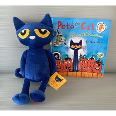 a blue stuffed cat next to a book about pete the cat and pumpkin patch books